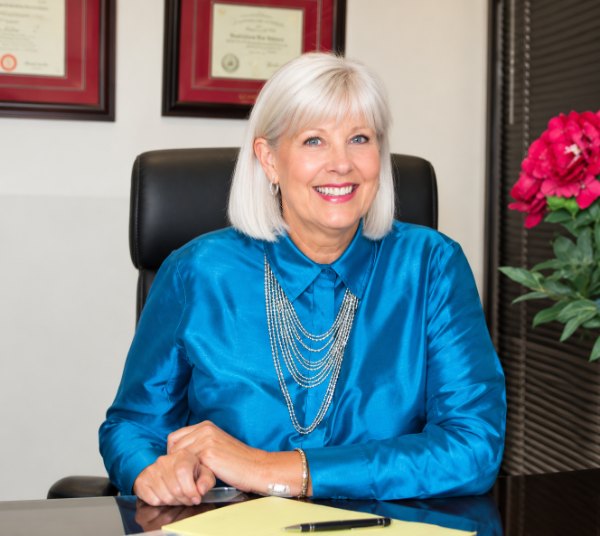 Ginger Houseman, MS, MA in her office